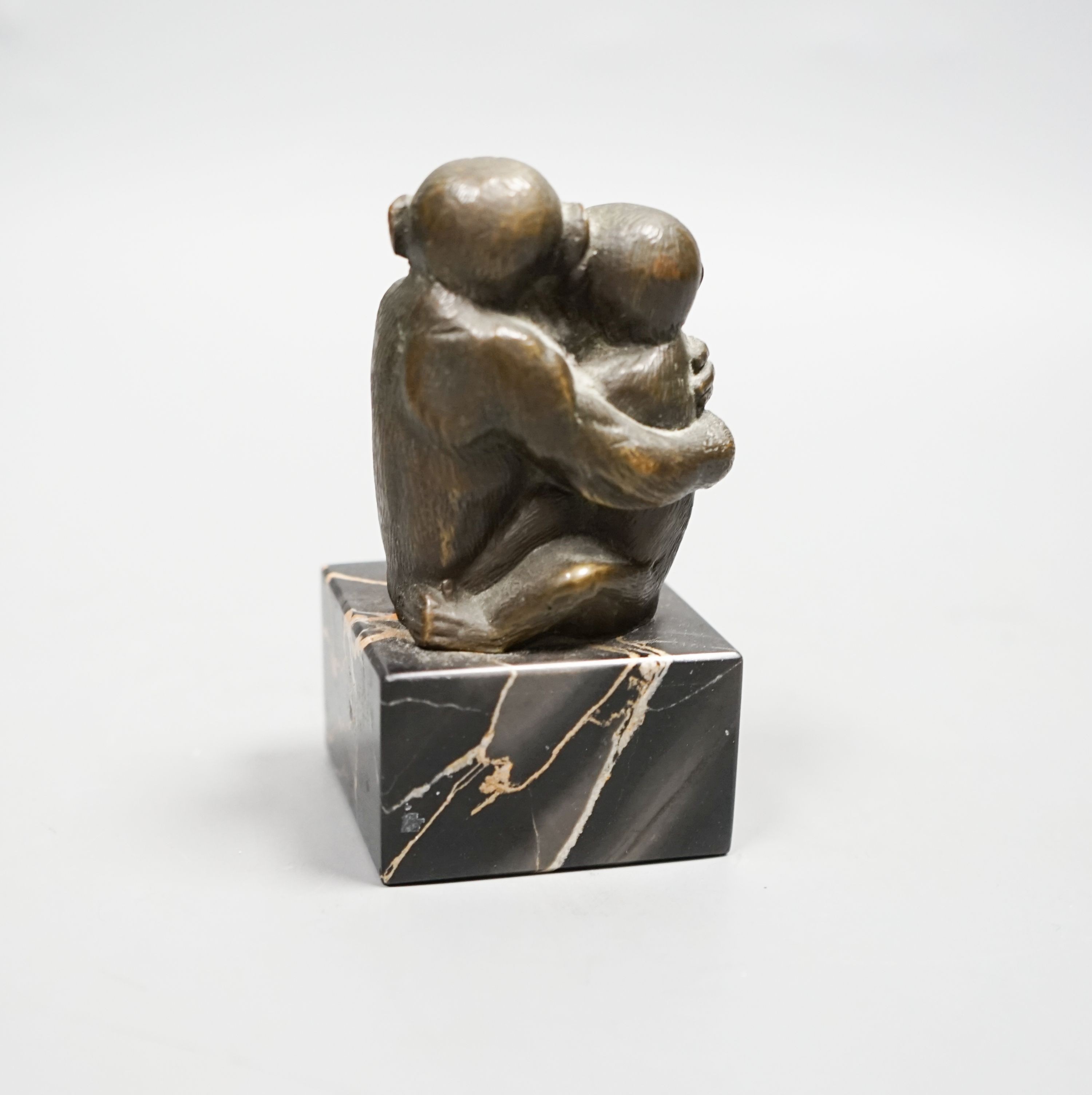 After Barye, bronze, Two monkeys embracing, on square veined black marble plinth, 10cm H 10cm